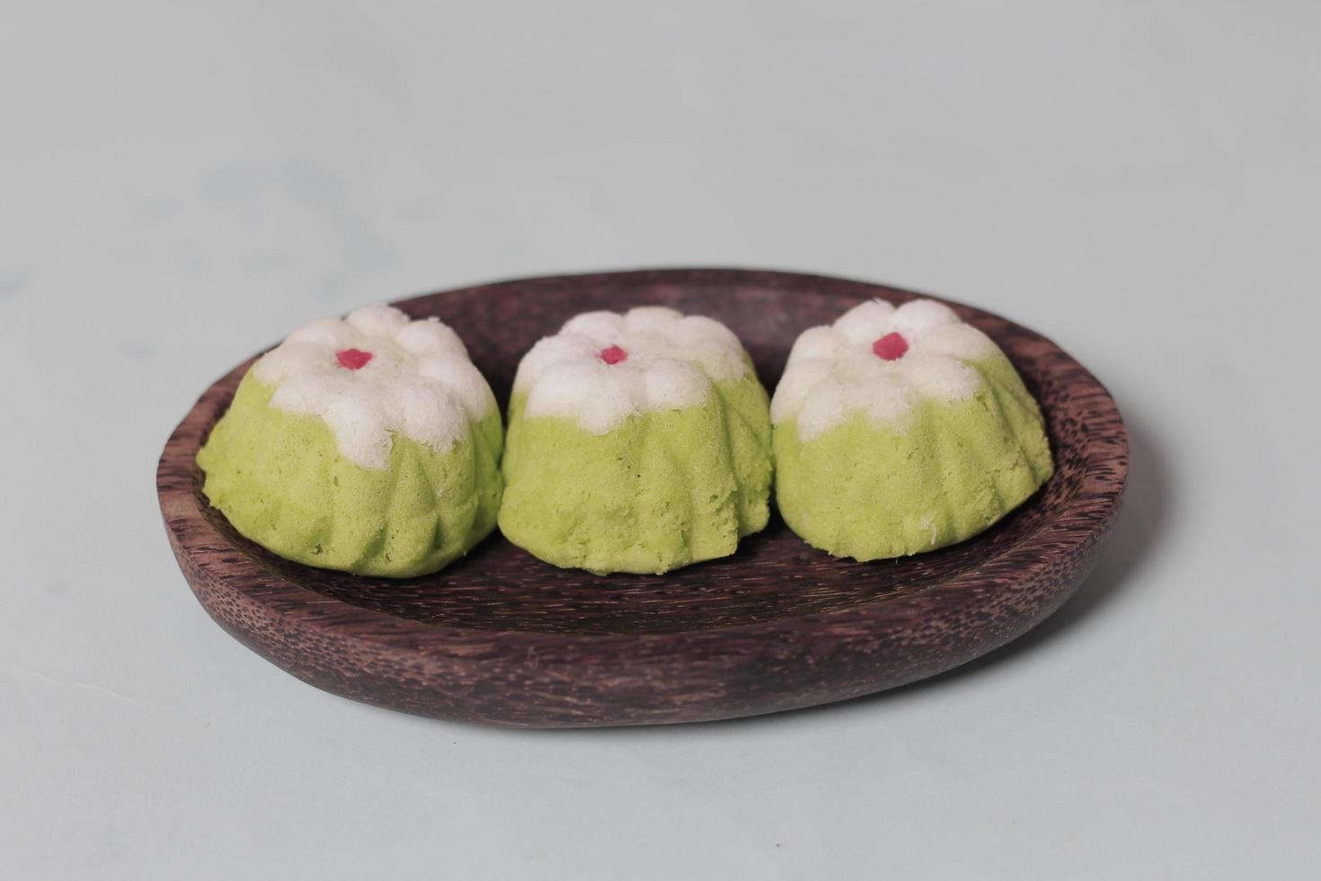 Putu Ayu as a snack in your spare time. Putu Ayu has a soft and tender texture. This putu cake has a very delicious and soft taste when eaten. Indonesian food. Has a pandan scent. Focus blur. photo