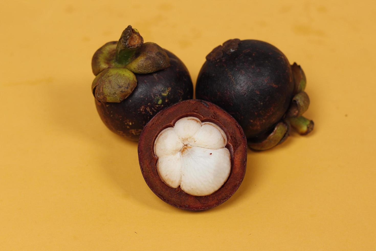 Mangosteen is a tropical fruit from Asia. Mangosteen has a distinctive sweet and sour taste. Mangosteen also has a myriad of benefits, properties, and nutritional content that is useful for health. photo