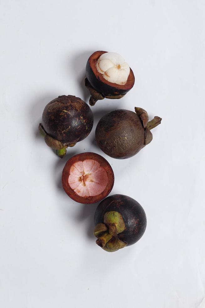 Mangosteen is a tropical fruit from Asia. Mangosteen has a distinctive sweet and sour taste. Mangosteen also has a myriad of benefits, properties, and nutritional content that is useful for health. photo