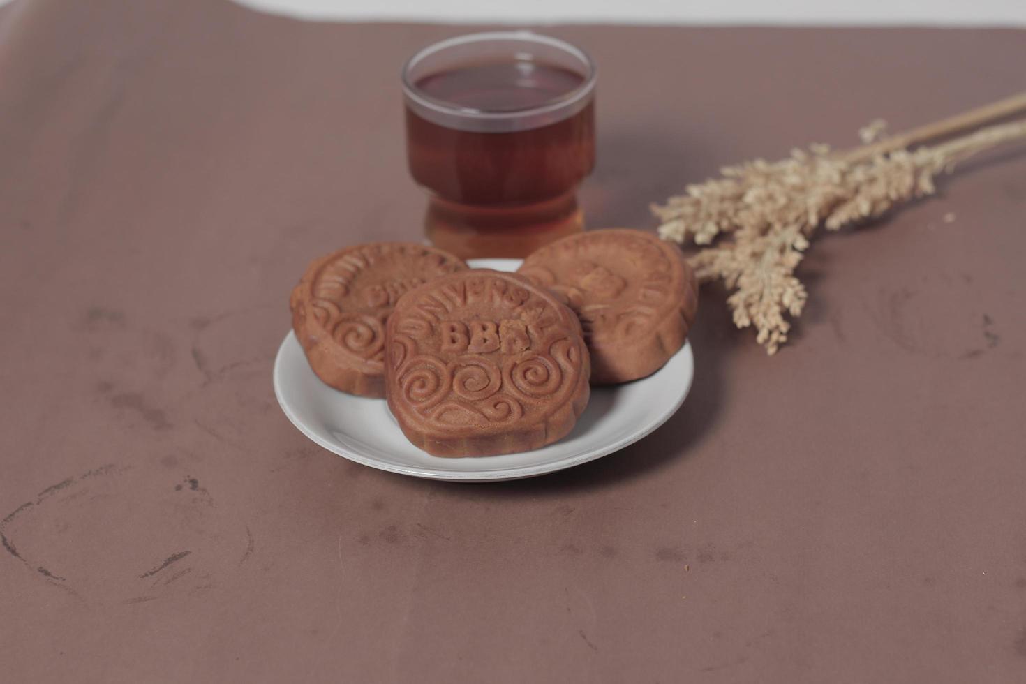 Square-shaped chocolate biscuits are suitable as a side snack to the breakfast menu. Start the morning with biscuits. Can be consumed by all ages from toddlers to the elderly. Stack of biscuits. photo