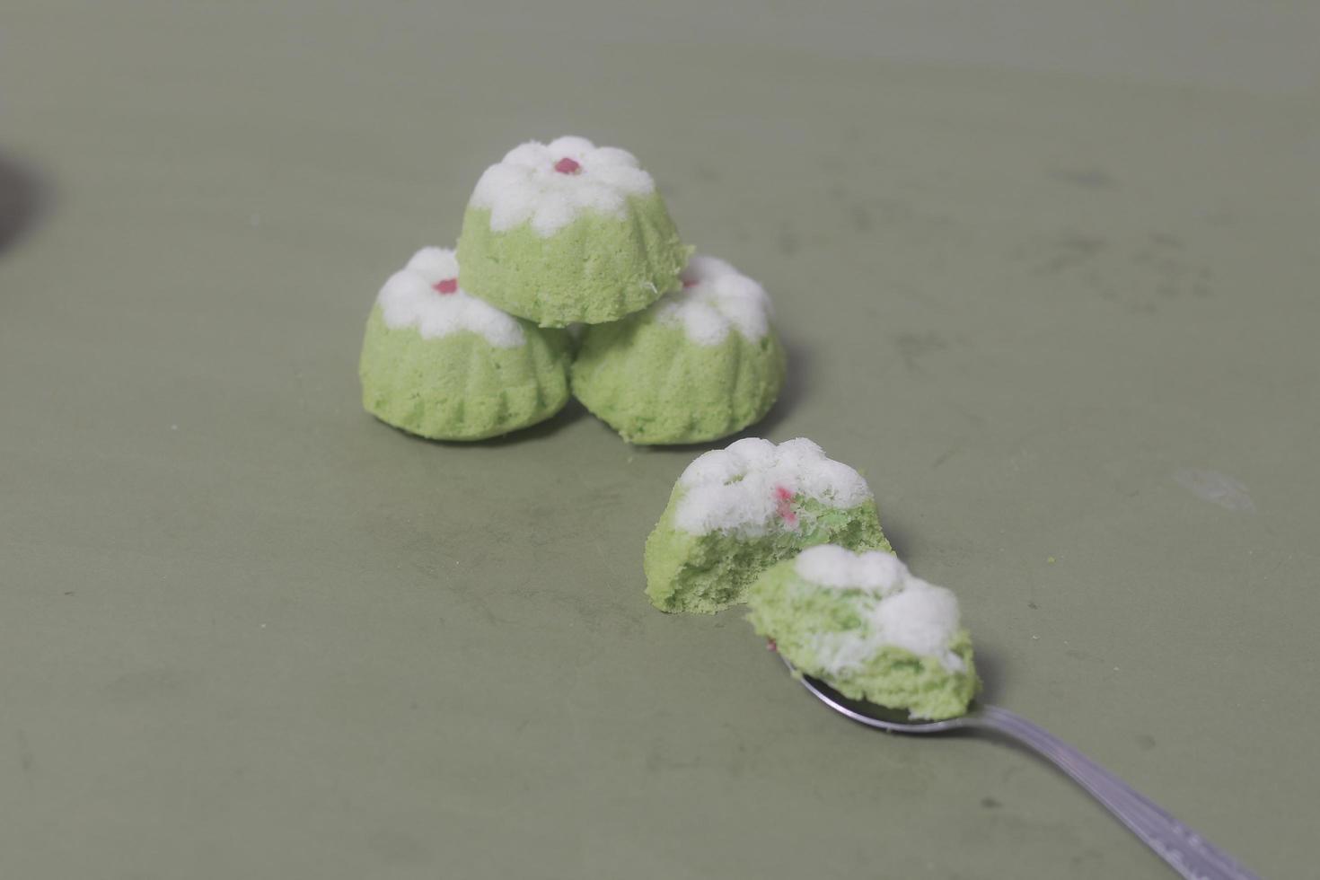 Putu Ayu as a snack in your spare time. Putu Ayu has a soft and tender texture. This putu cake has a very delicious and soft taste when eaten. Indonesian food. Has a pandan scent. Focus blur. photo