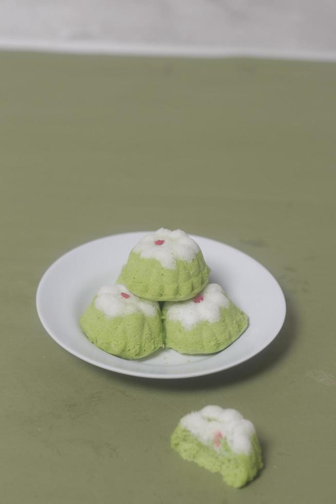 Putu Ayu as a snack in your spare time. Putu Ayu has a soft and tender texture. This putu cake has a very delicious and soft taste when eaten. Indonesian food. Has a pandan scent. Focus blur. photo