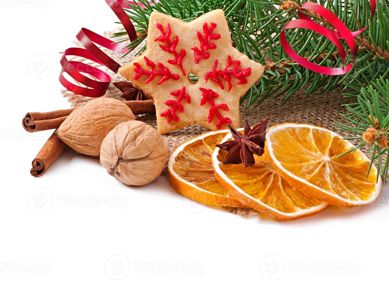Christmas cookies, spices and spruce branches isolated on white background photo
