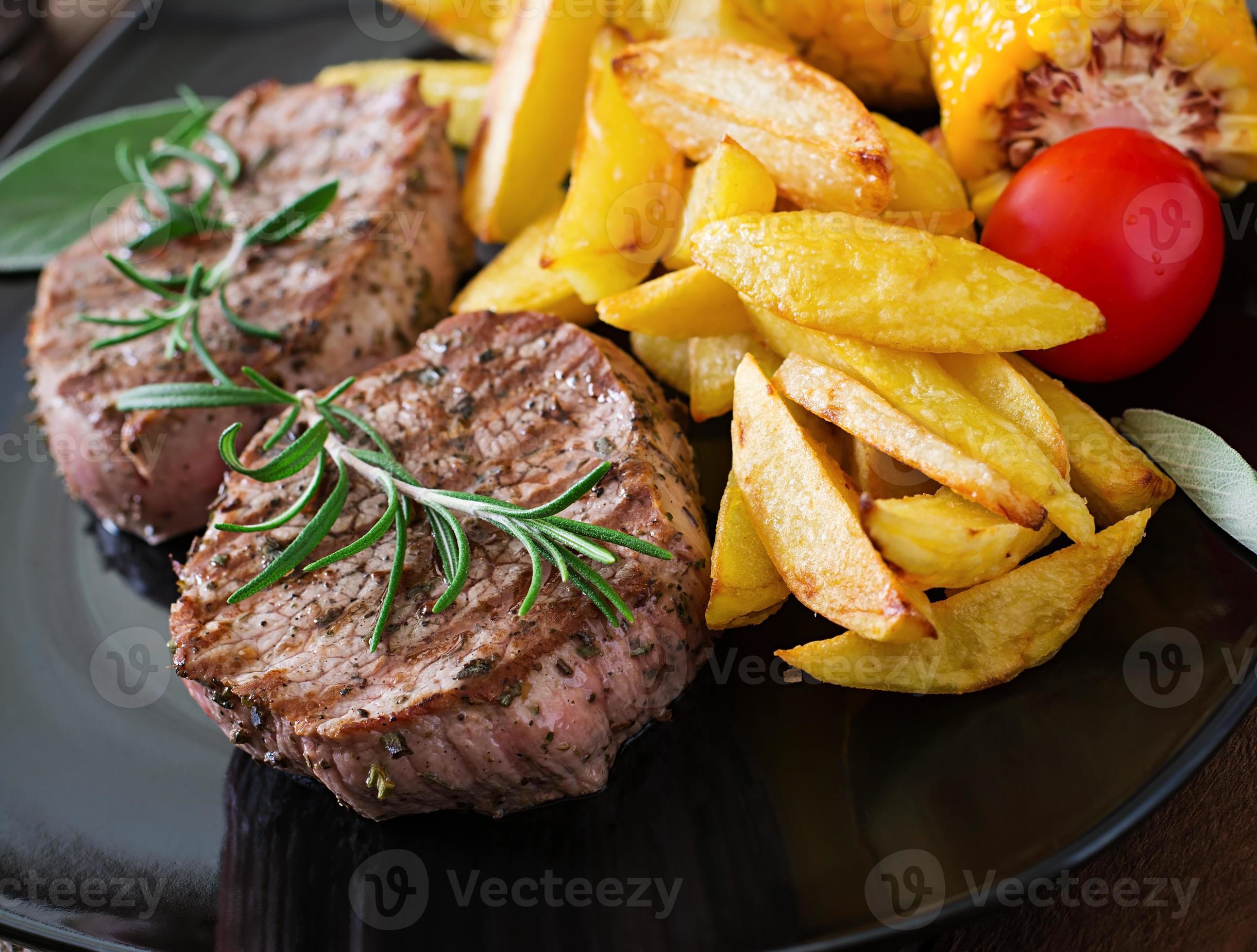 Tender and juicy veal steak medium rare with French fries 7586626 Stock