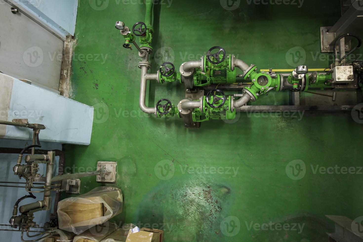 Green pipeline and valve equipment for water supply system control room photo