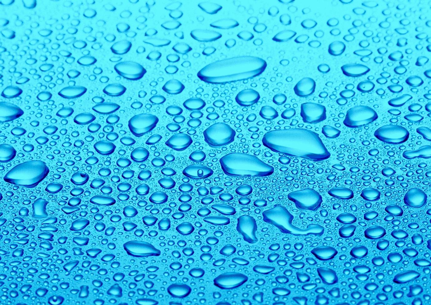 Water drops on blue background photo