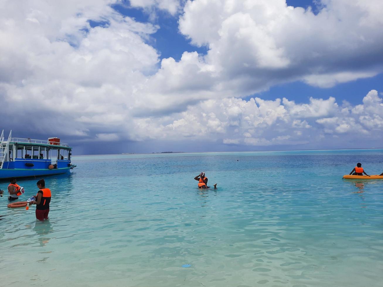 Maldives, April 2021 - Tourists spend the day on a beautiful island in the Maldives. The Maldives is a collection of different islands. Most of the islands are rich in natural beauty. photo