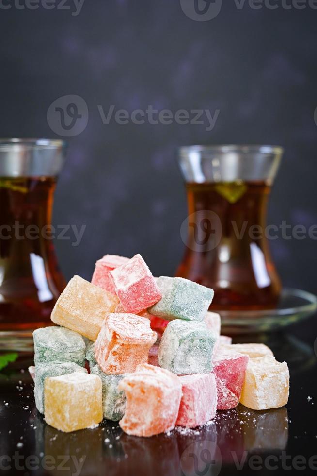 Turkish delights lokum on dark background photo