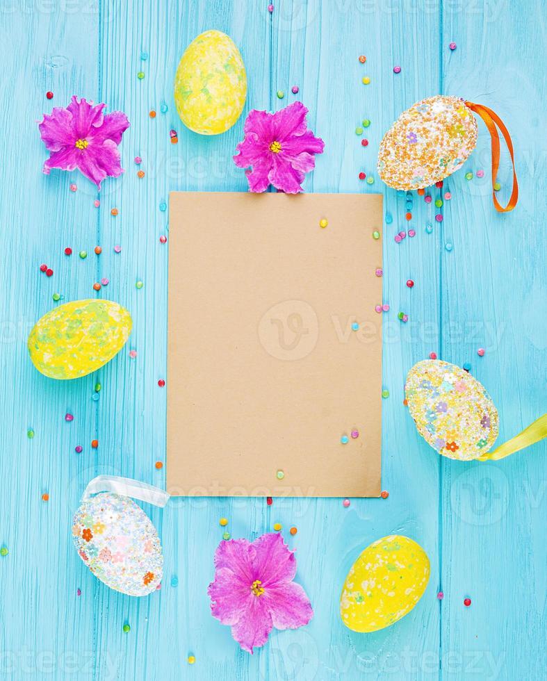 Easter background with flowers and easter eggs. Top view photo