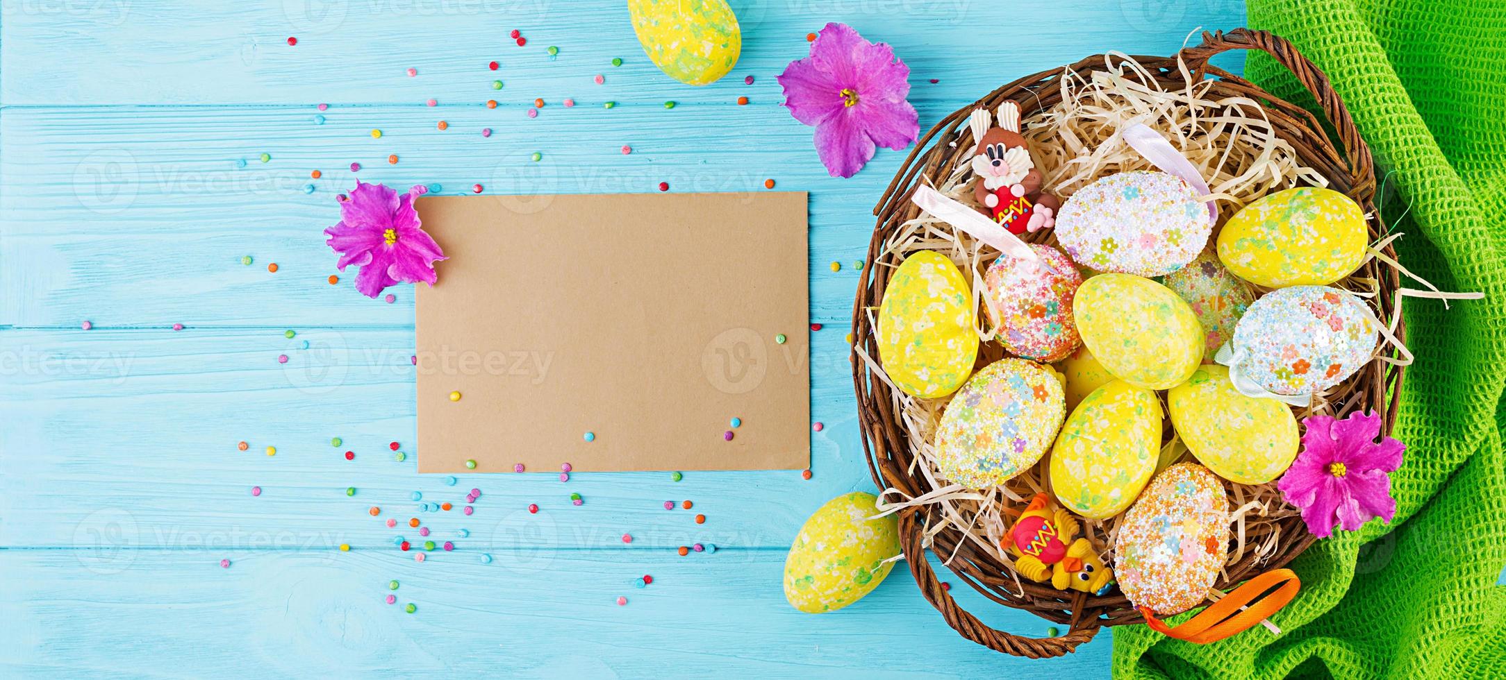 Banner with easter background. Background with flowers and easter eggs. Top view photo