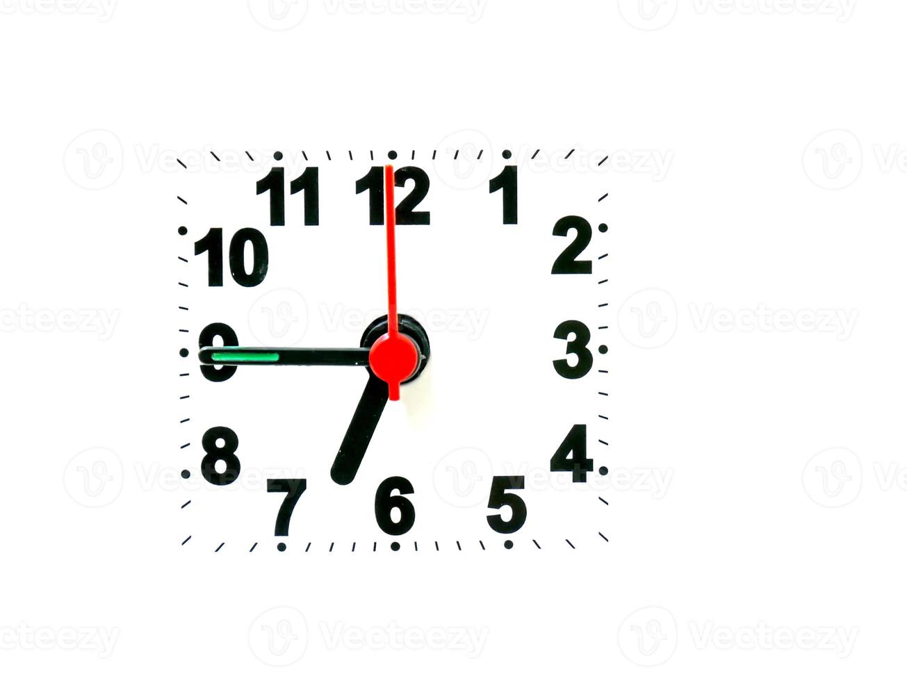 clock showing time on a white background photo