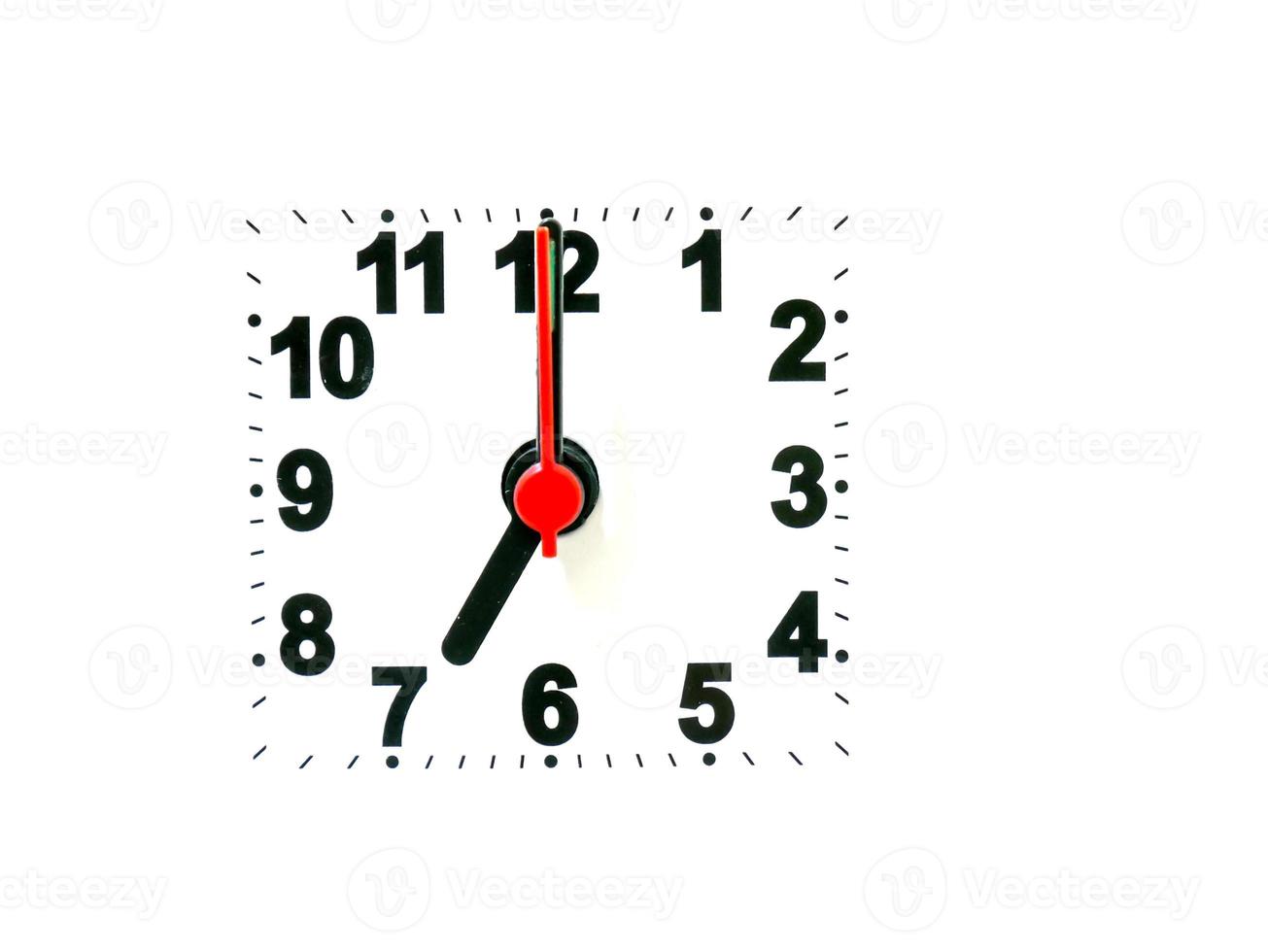 clock showing time on a white background photo