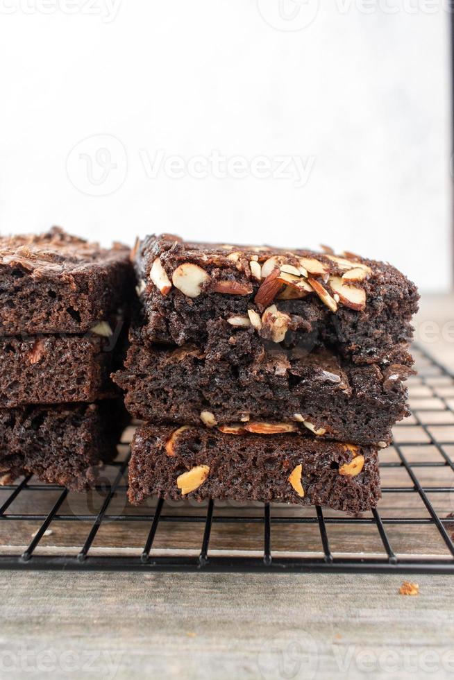 stack of sliced homemade brownie squares with almonds photo