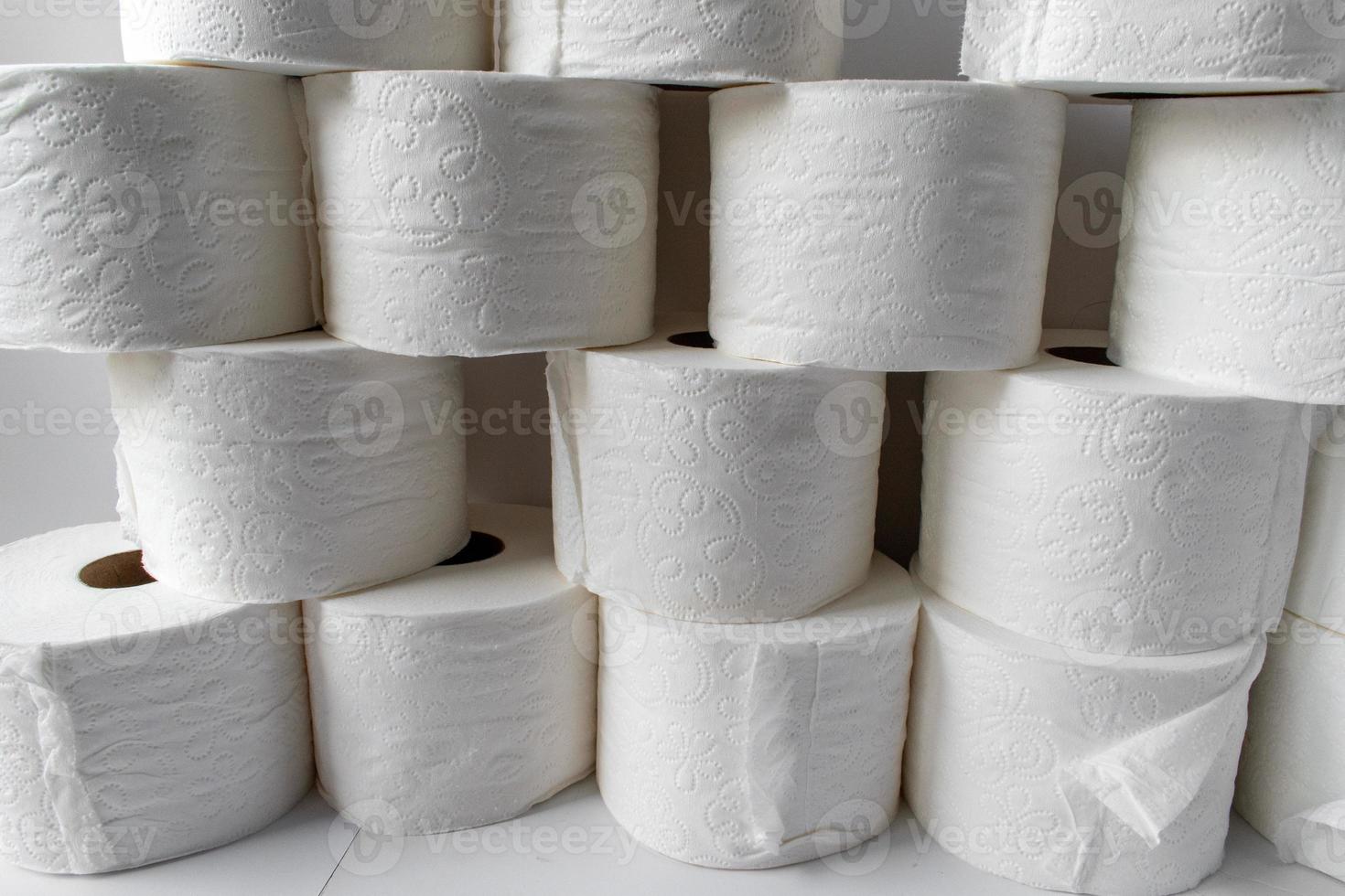 stocking up on supplies showing toilet paper rolls stacked photo