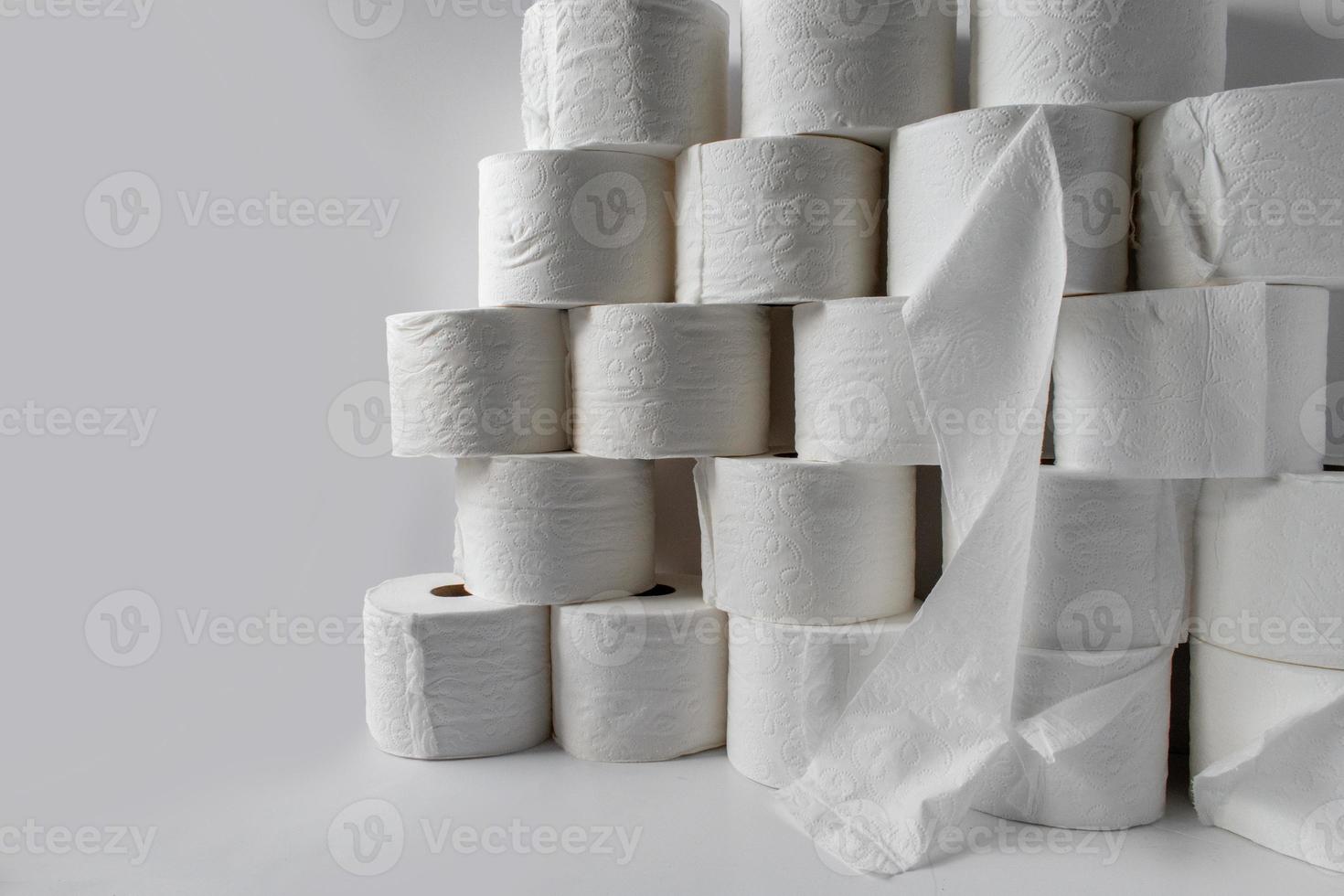 stocking up on supplies showing toilet paper rolls stacked photo