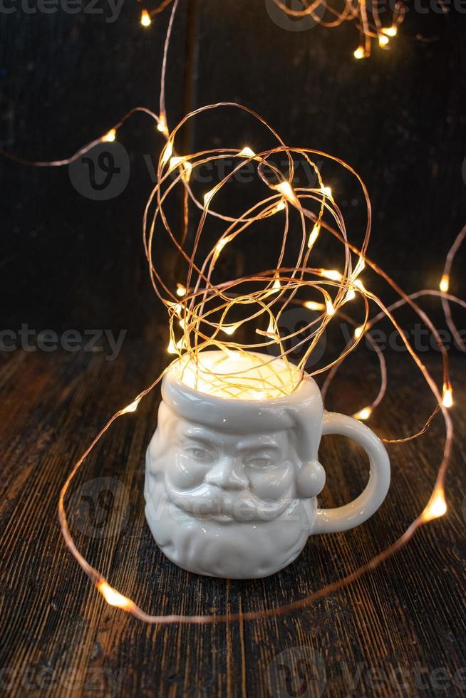 moody hipster santa shaped mug with crazy Christmas lights coming out of top photo