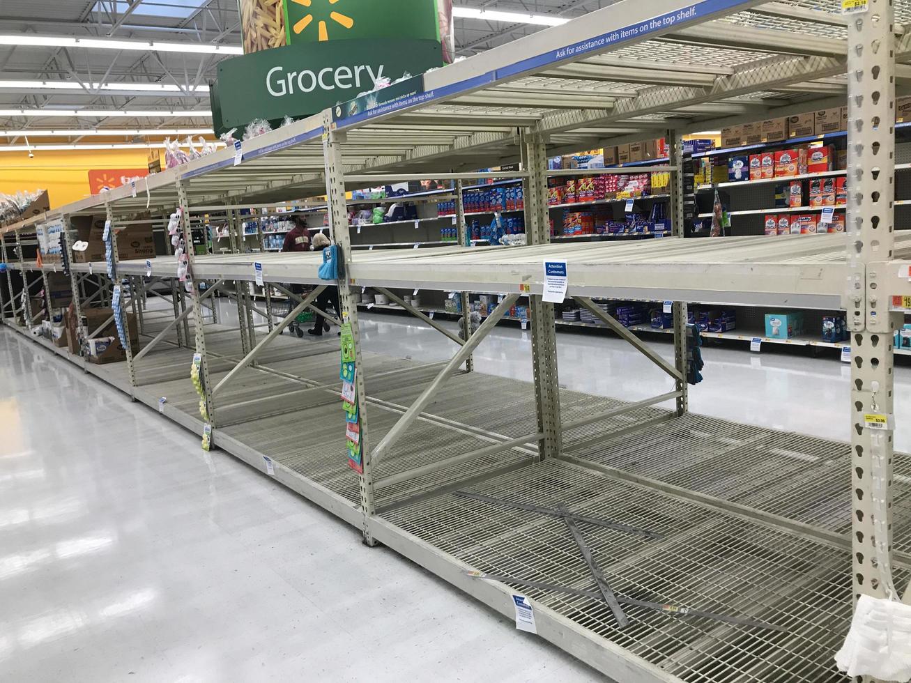 United States, March 2020 - empty toilet paper and paper towel racks in grocery store during COVID-19 photo