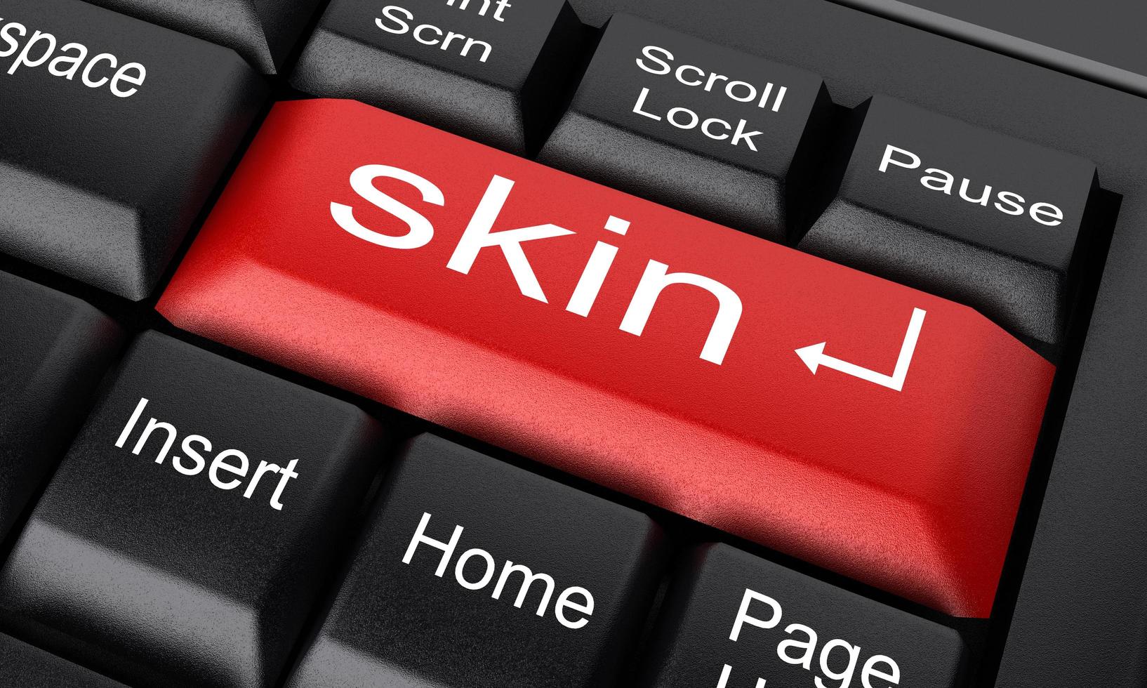 skin word on red keyboard button photo