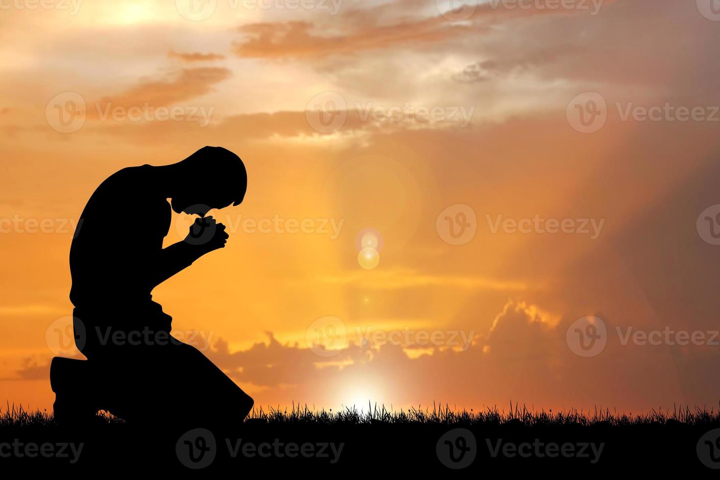 Silhouette of Christian Praying Hands Spiritual and Religious People Praying to God Christianity Concepts photo