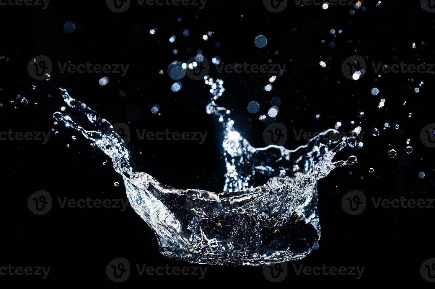 Abstract background of Water splashing on a black background. idea for freshness photo