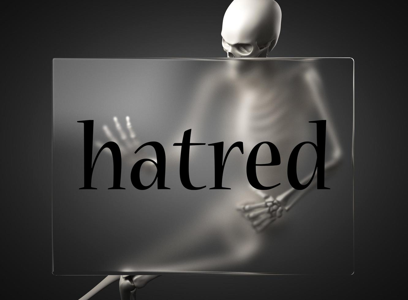 hatred word on glass and skeleton photo