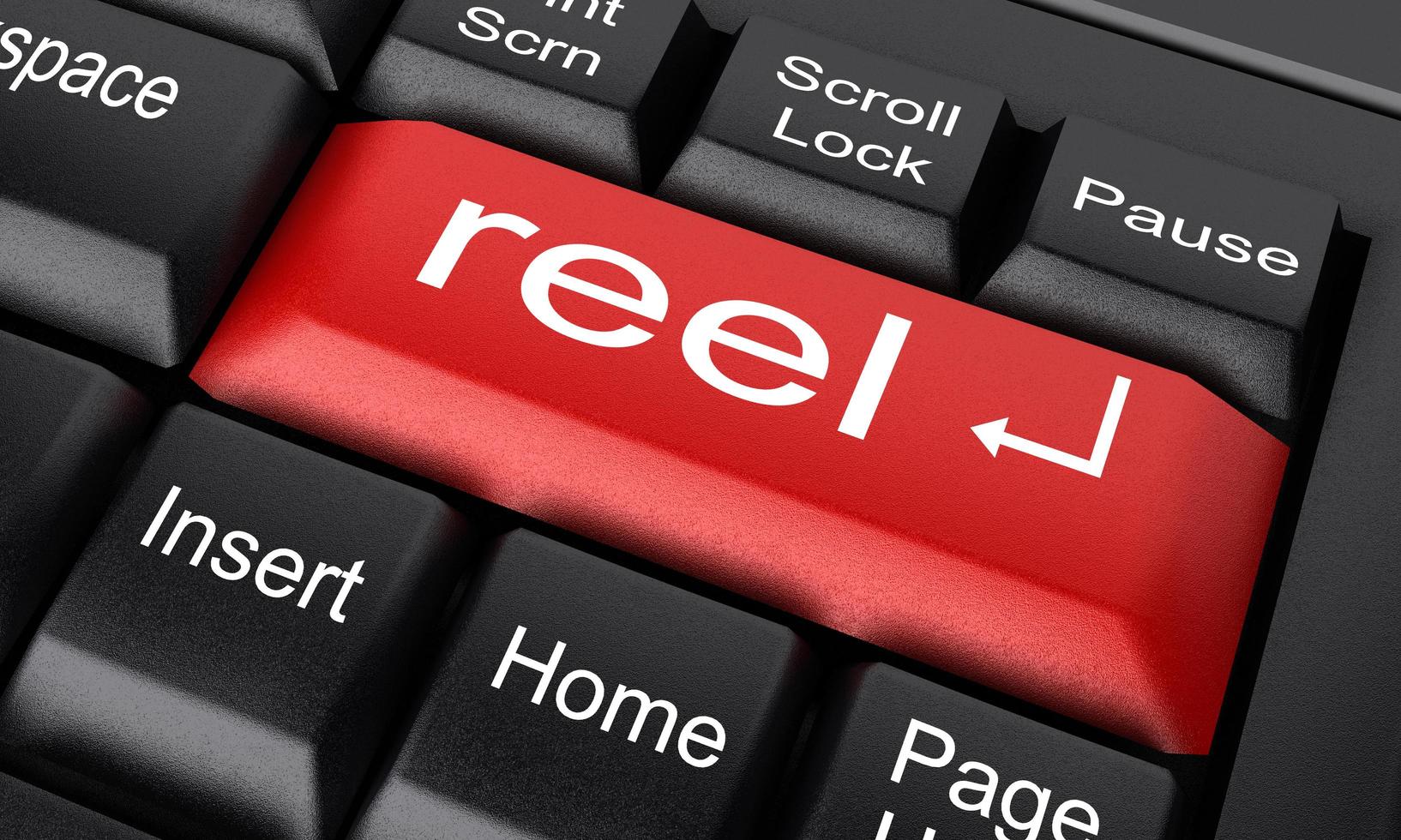 reel word on red keyboard button photo