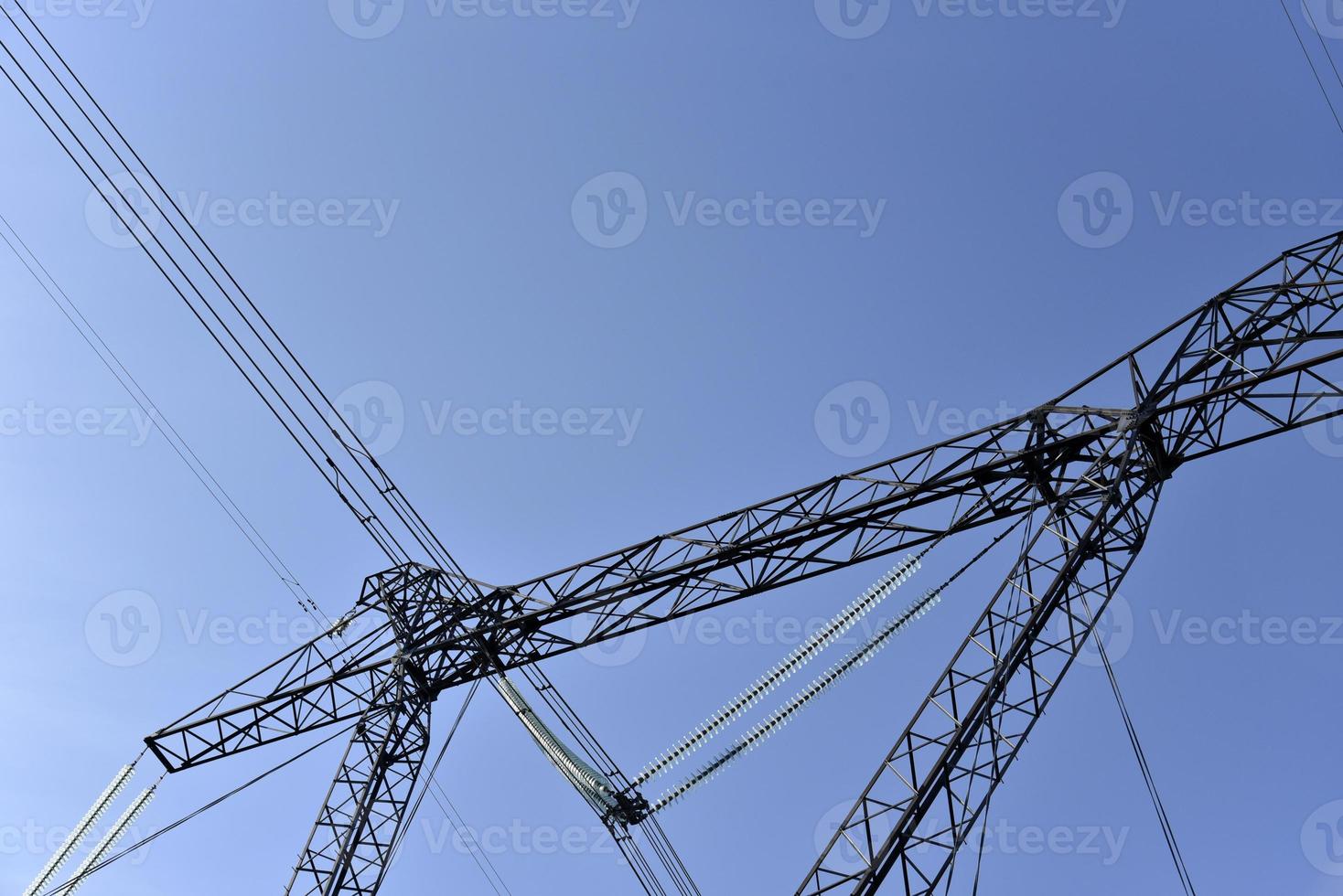 Ultra-high voltage power line in the field in spring in Russia photo