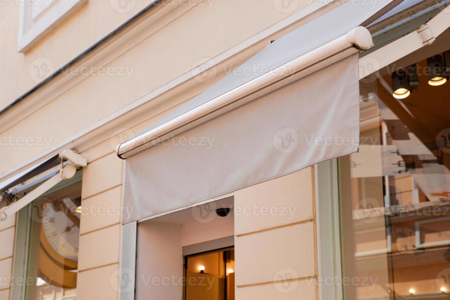 Shop awning on modern on the modern city facade and shop window. Clean for text or logo presentation photo