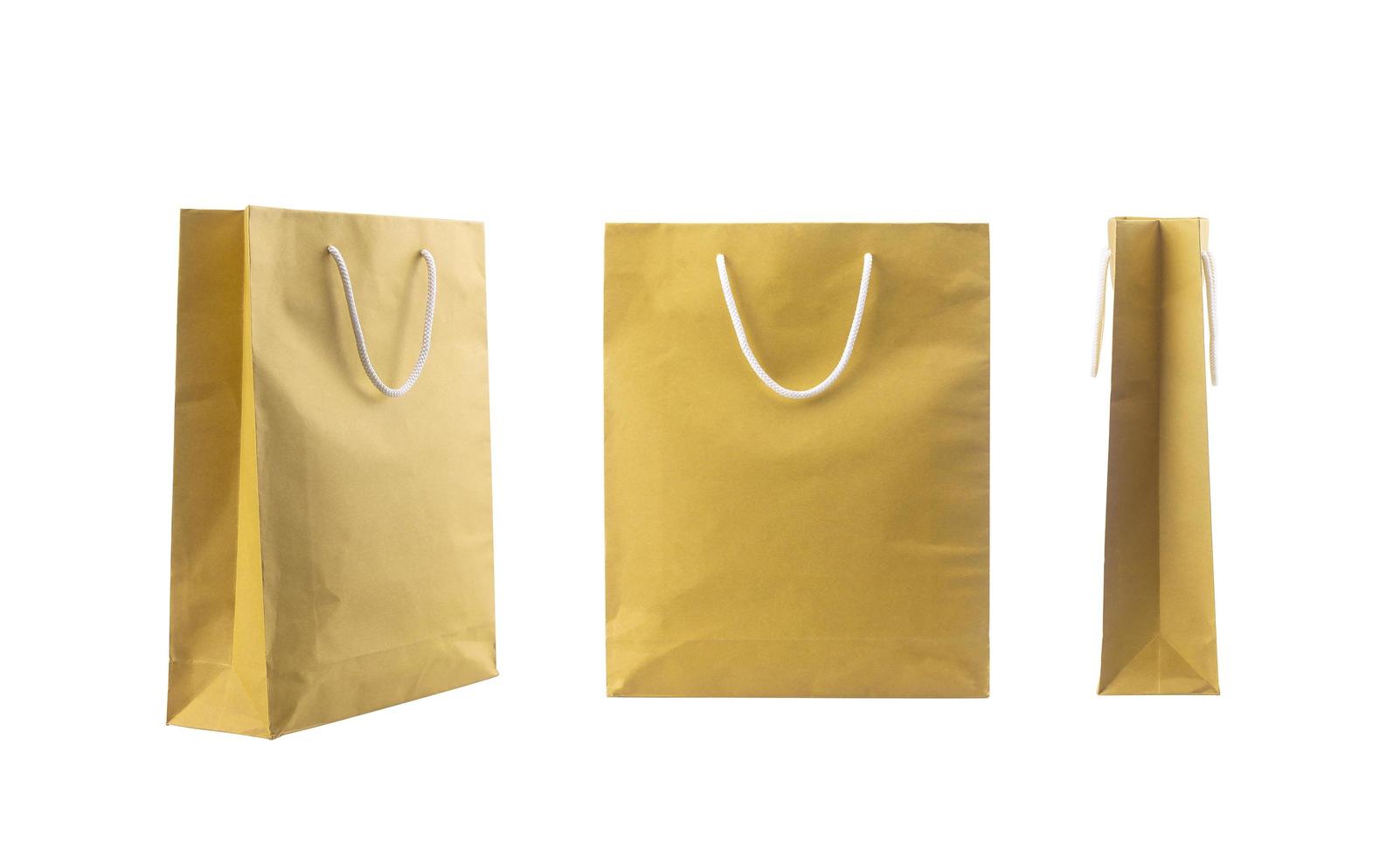 Brown folded paper bag with handles isolated on white background photo