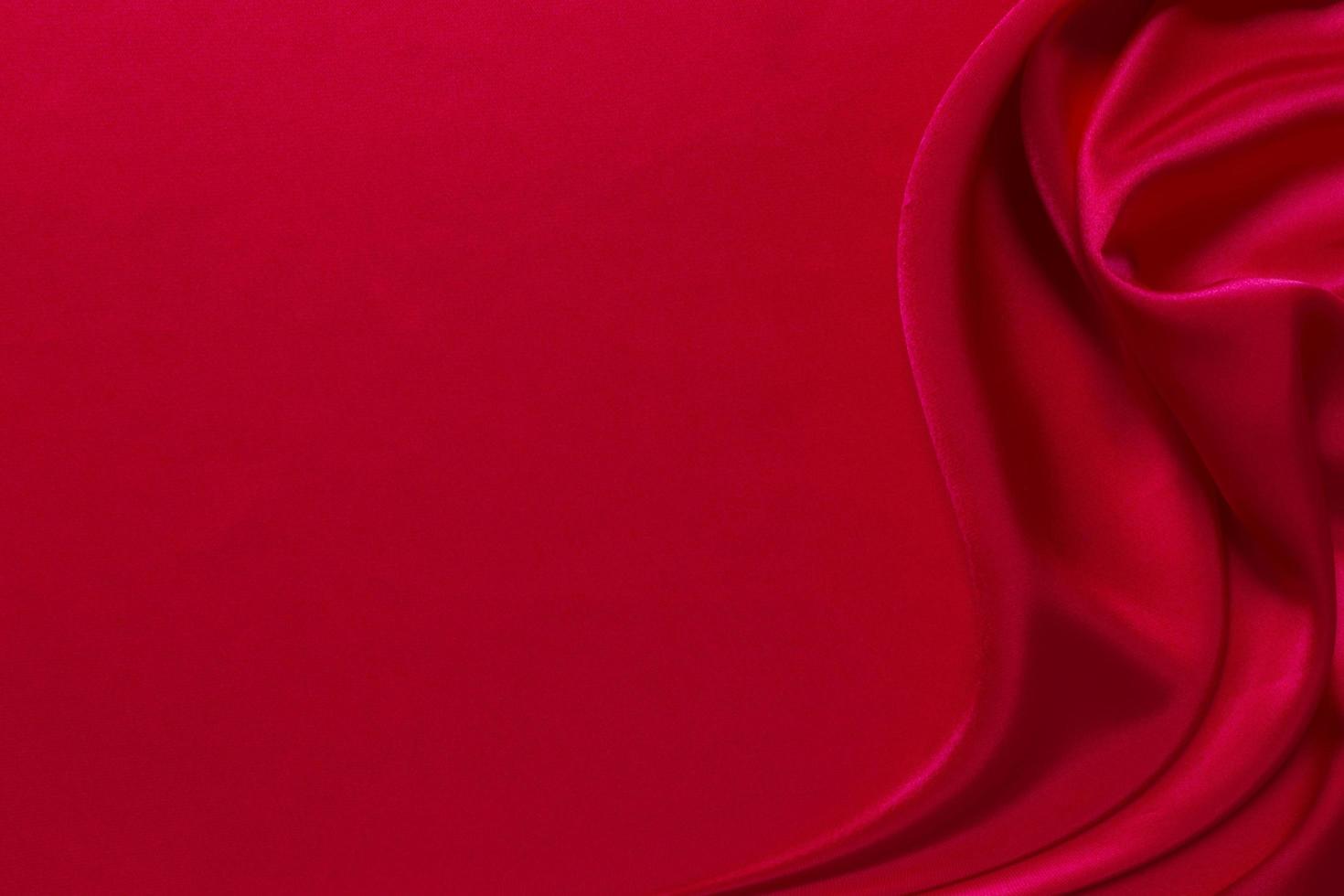 Red silk or satin luxury fabric texture can use as abstract background photo