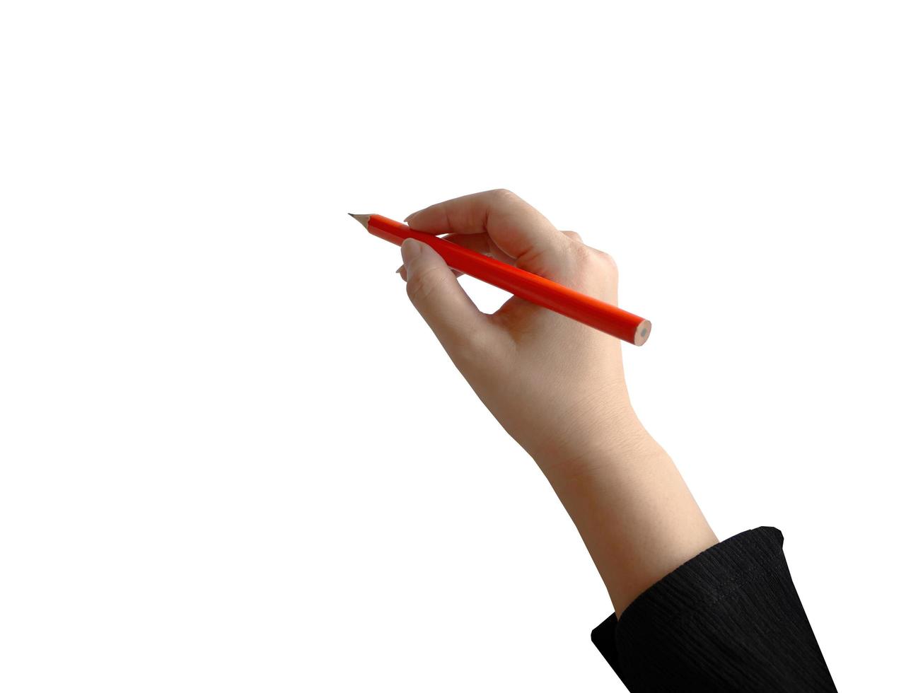 Isolated female hand holding orange color pencil writing, for presentation element photo