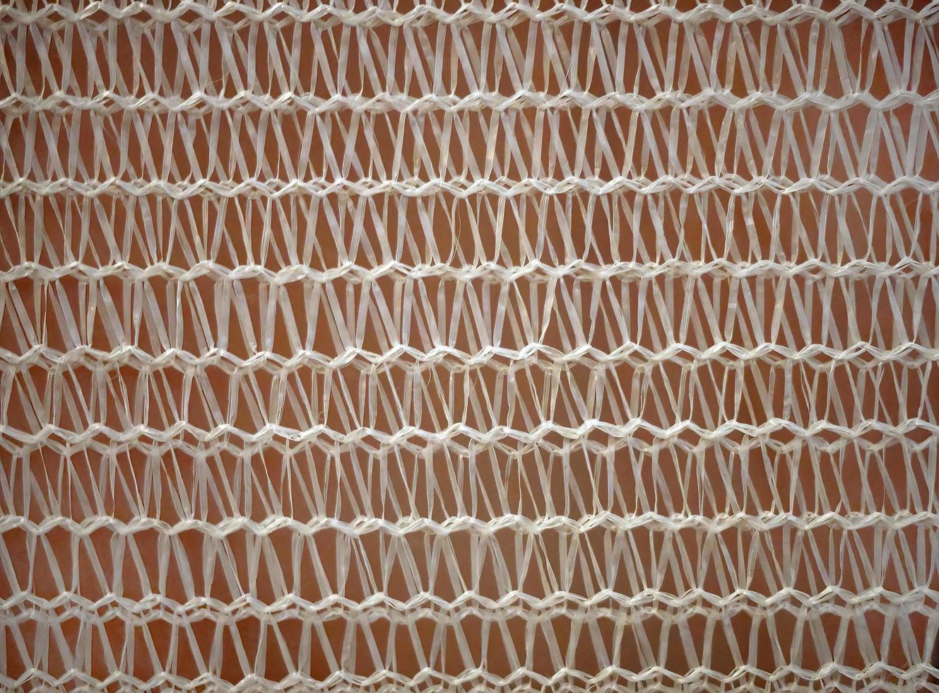 Close up White plastic handmade woven net decorating wall photo