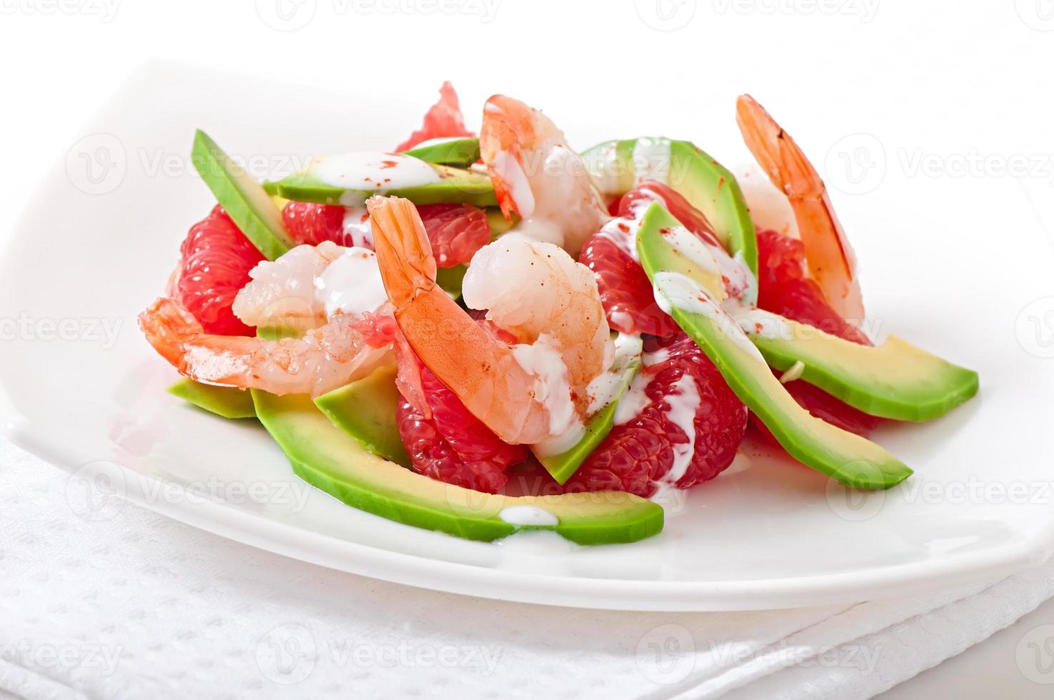 California salad - a mix of avocado, grapefruit and shrimp, seasoned with cayenne pepper yogurt photo