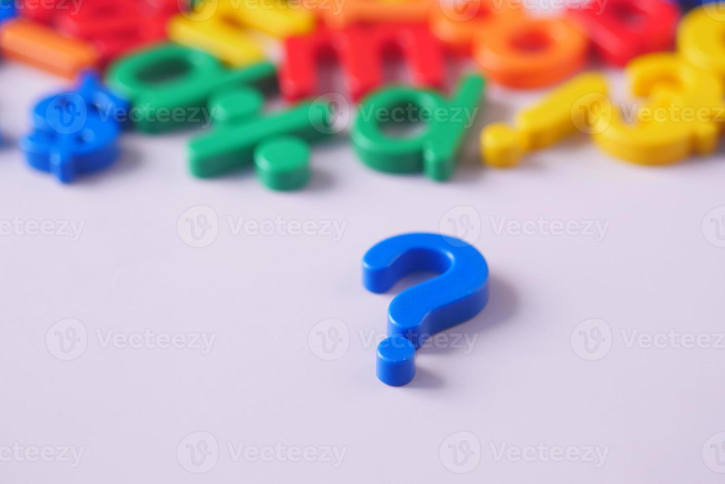 question mark on a pink background with copy space photo