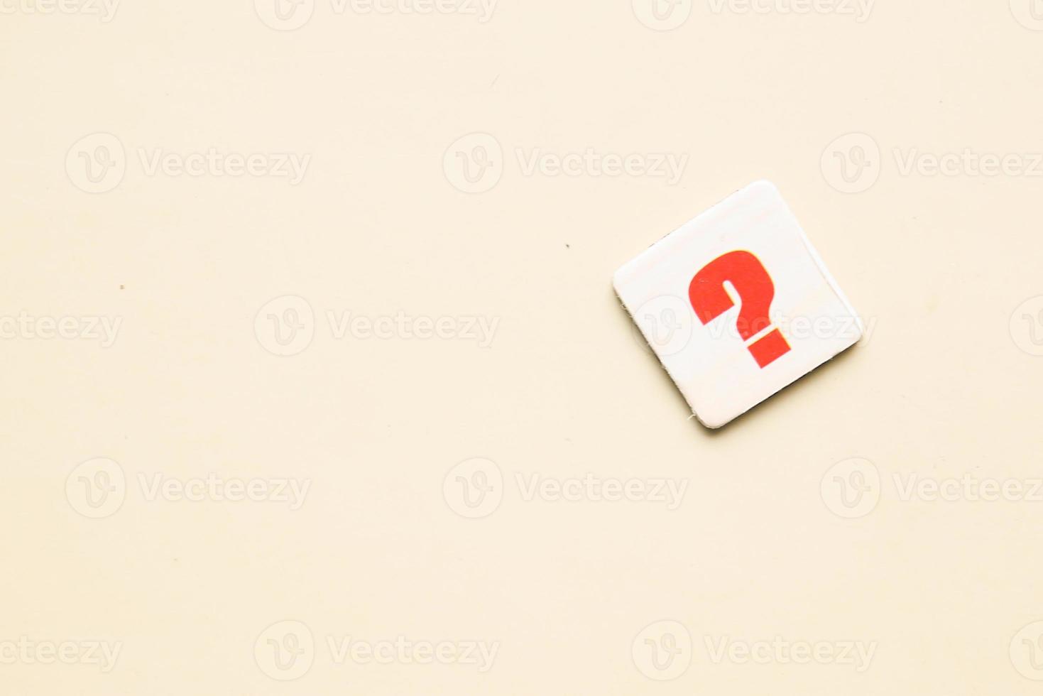 question mark on a pink background with copy space photo