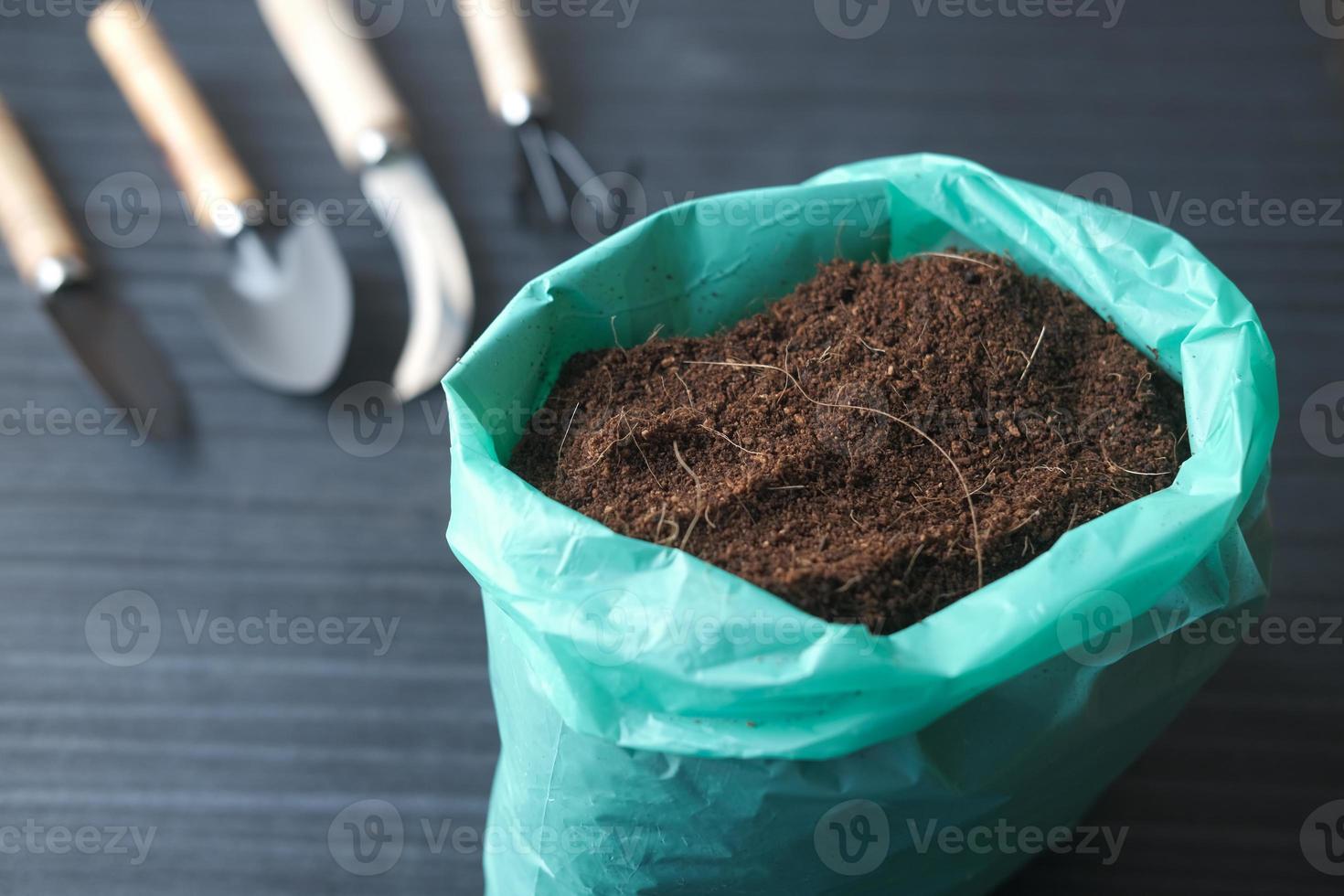 coco peat and gardening tools a table with copy space photo