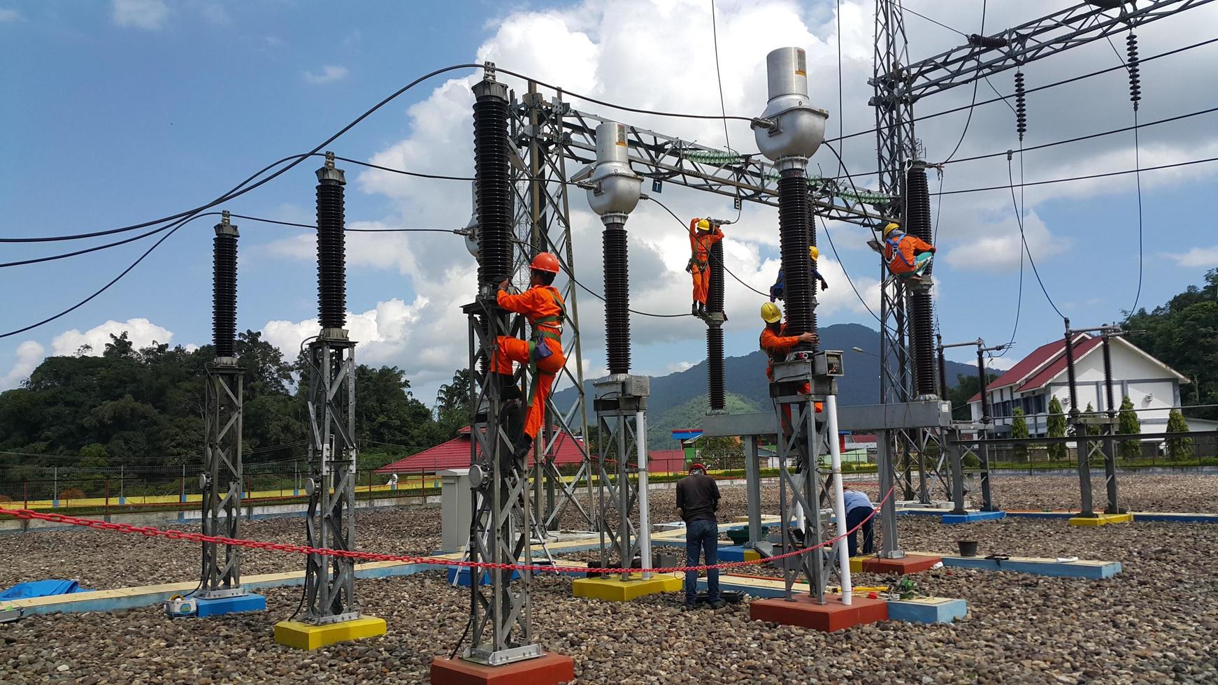 some technicians are working at the power plant photo