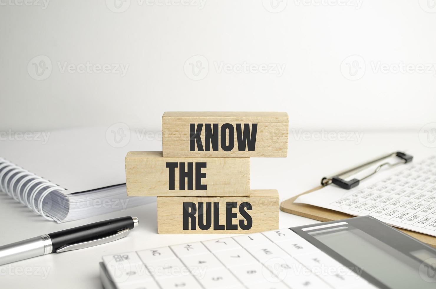 Know the rules word on wooden blocks isolated on dark grey background photo