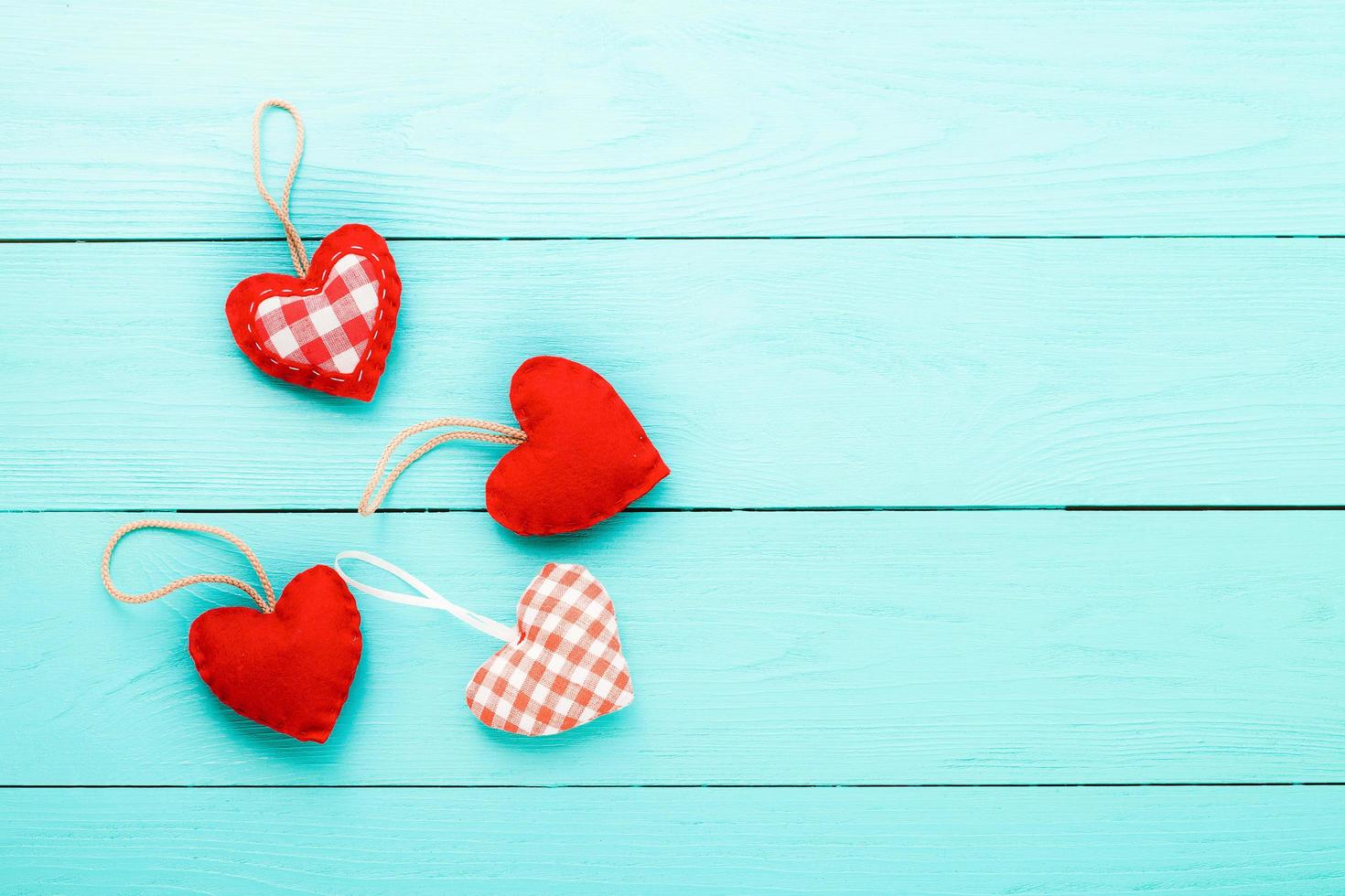 Hearts on blue wooden background. Valentines day. Top view photo