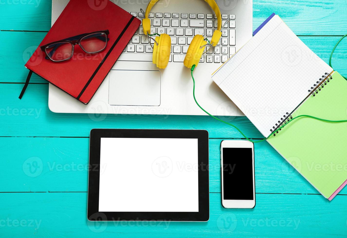 Workplace with business objects on blue wooden table. Top view and copy space photo