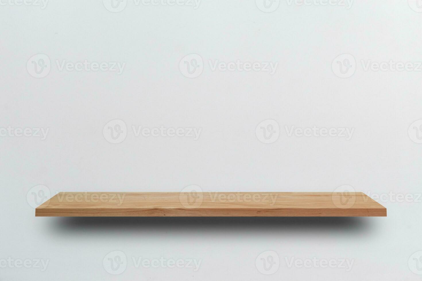 Front view empty wooden shelf and grey wall. Design concept photo