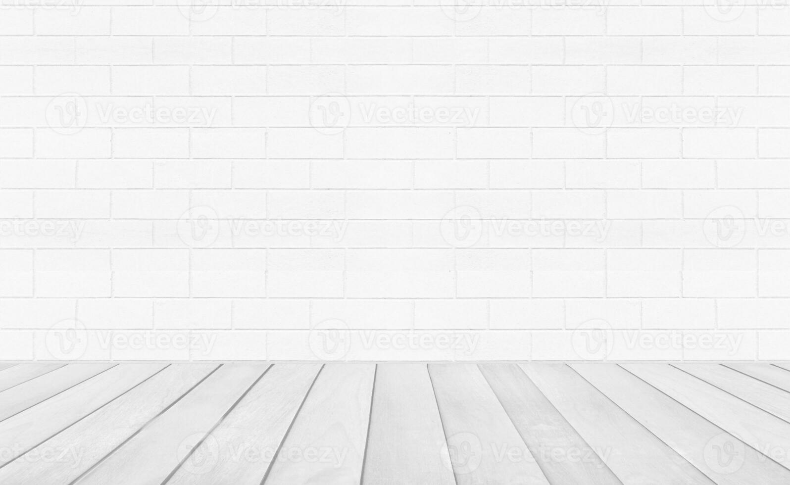 Empty room with grey wooden floor with brick wall background. Studio or office blank space. photo