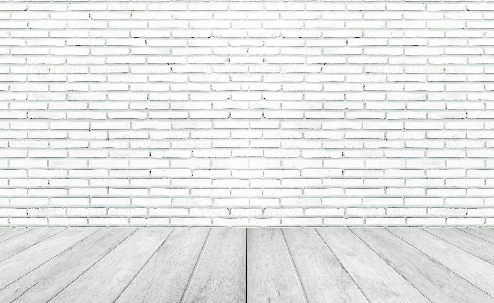 Empty room with grey wooden floor with brick wall background. Studio or office blank space. photo