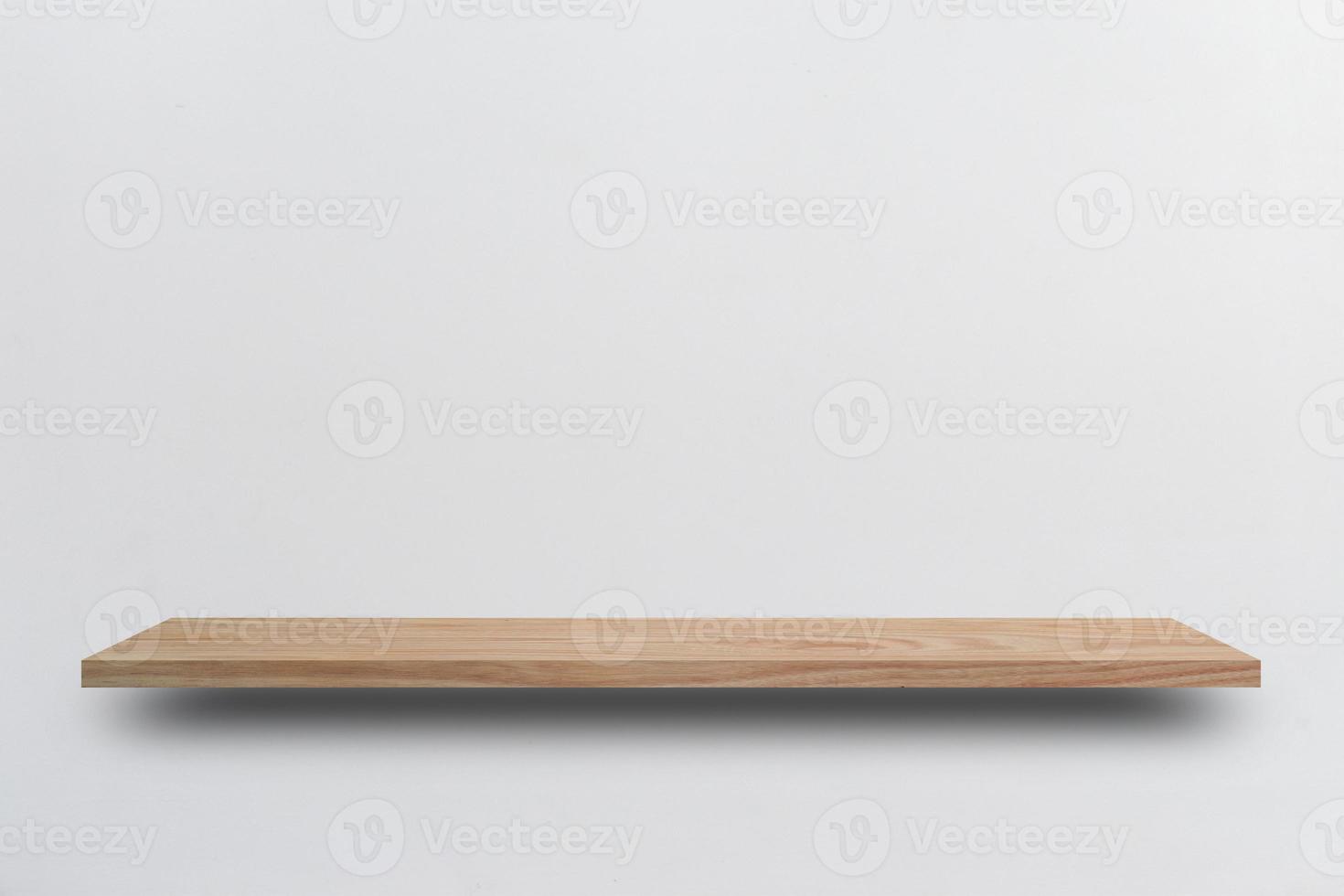 Front view empty wooden shelf and grey wall. Design concept photo