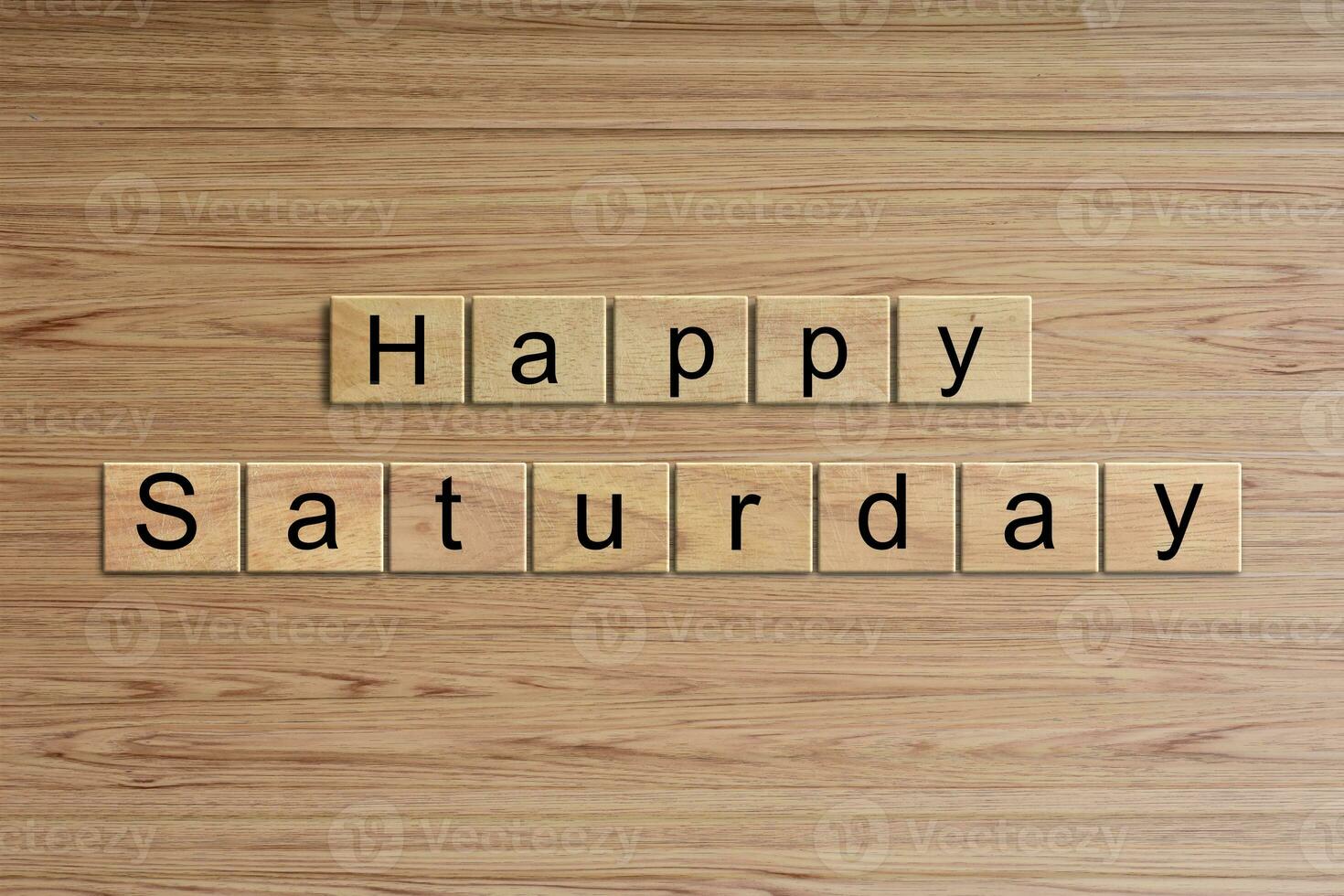 Happy Saturday word written on wood block. Message text on wooden table for backdrop design. photo