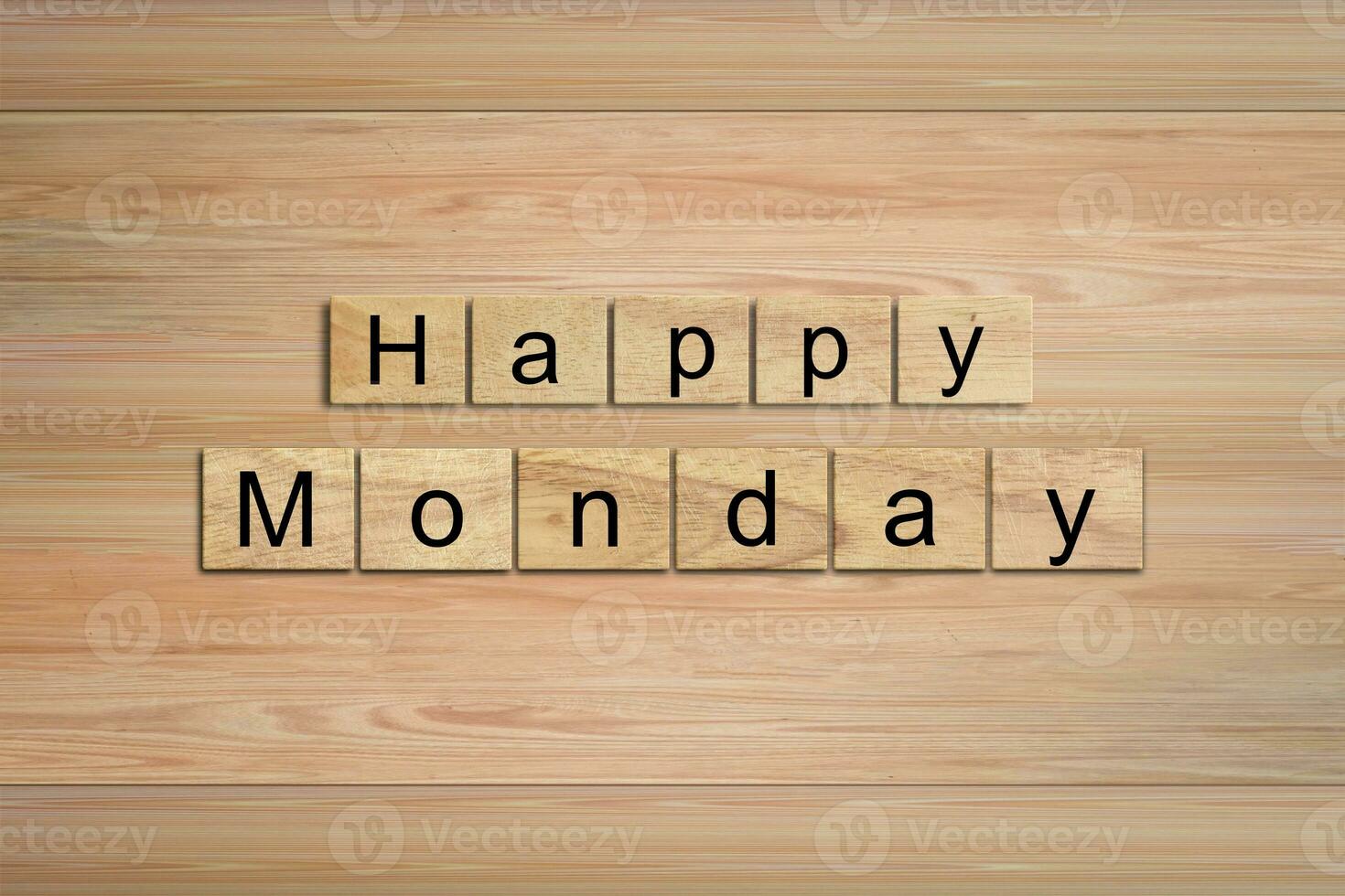 Happy Monday word written on wood block. Message text on wooden table for backdrop design. photo