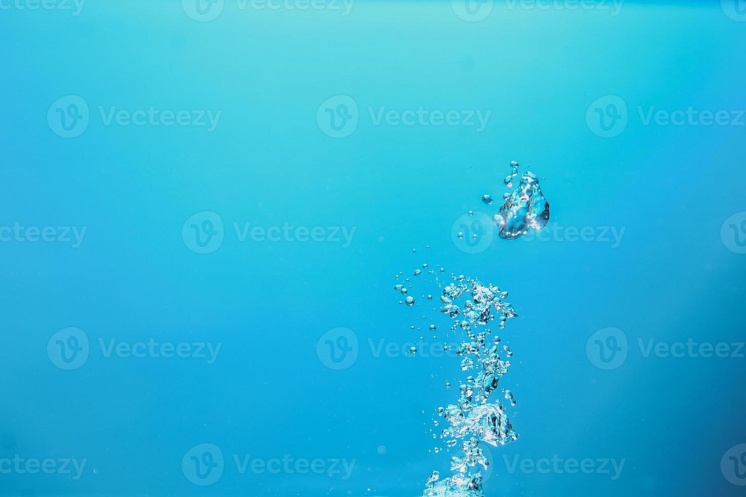 Abstract background image of bubbles in blue water. photo