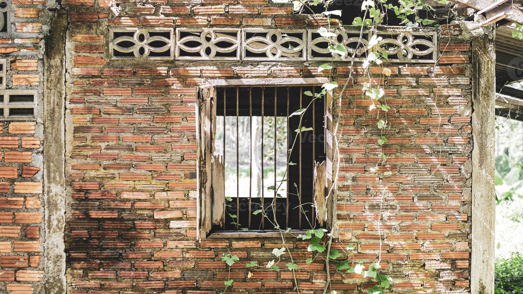 Window of an old abandoned house. Scary. Scary place concept. photo