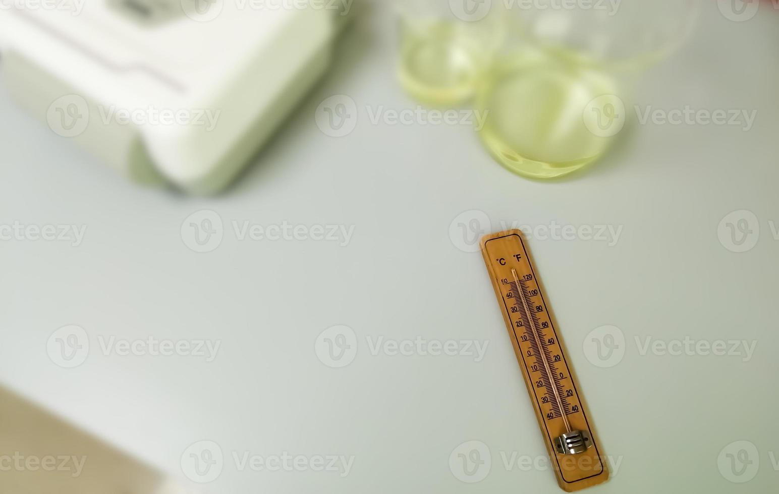 Analog fridge thermometer isolated. Thermal detector. Selective focus. photo