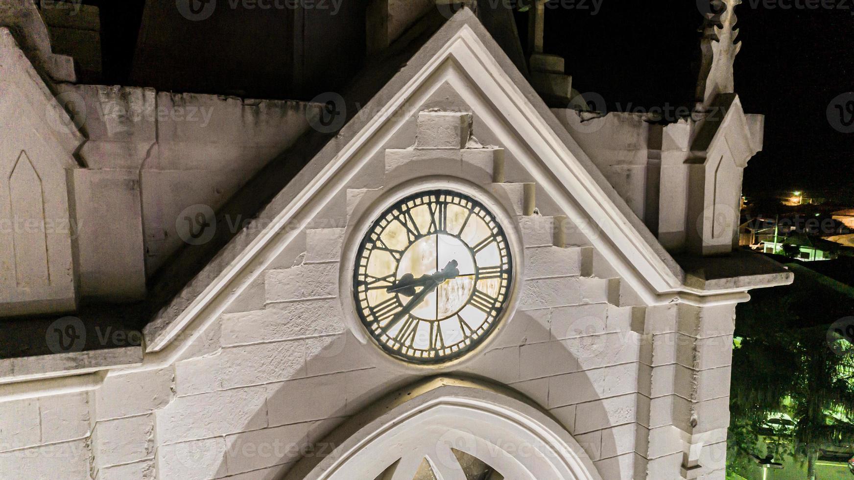 Close up of clock on church in Itamogi, Minas Gerais, Brazil. photo